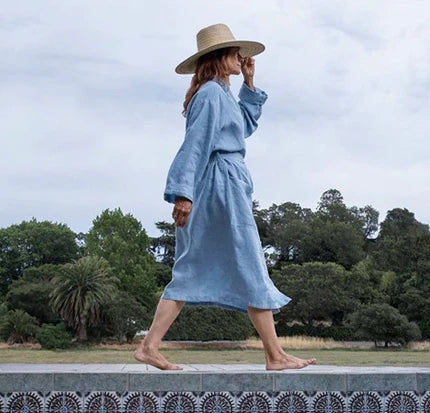 woman wearing a blue bathrobe