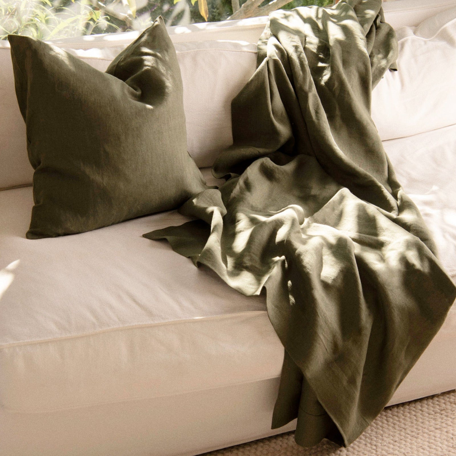 https://www.roughlinen.com/cdn/shop/files/st_barts_moss_pillow_throw_1600x.jpg?v=1696951618