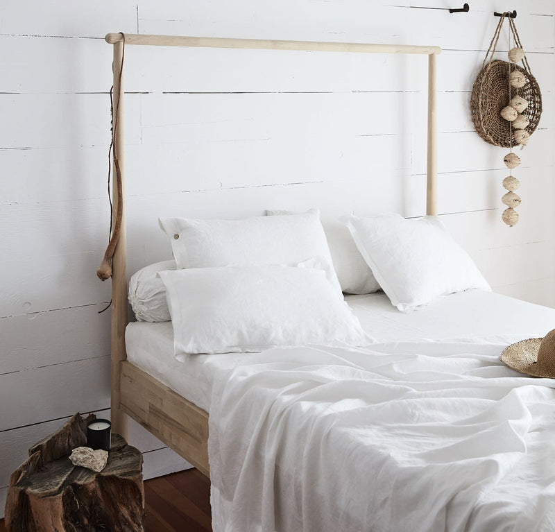 bedroom scene with 100% linen summer cover blanket with frayed raw edge detail natural beige tan color